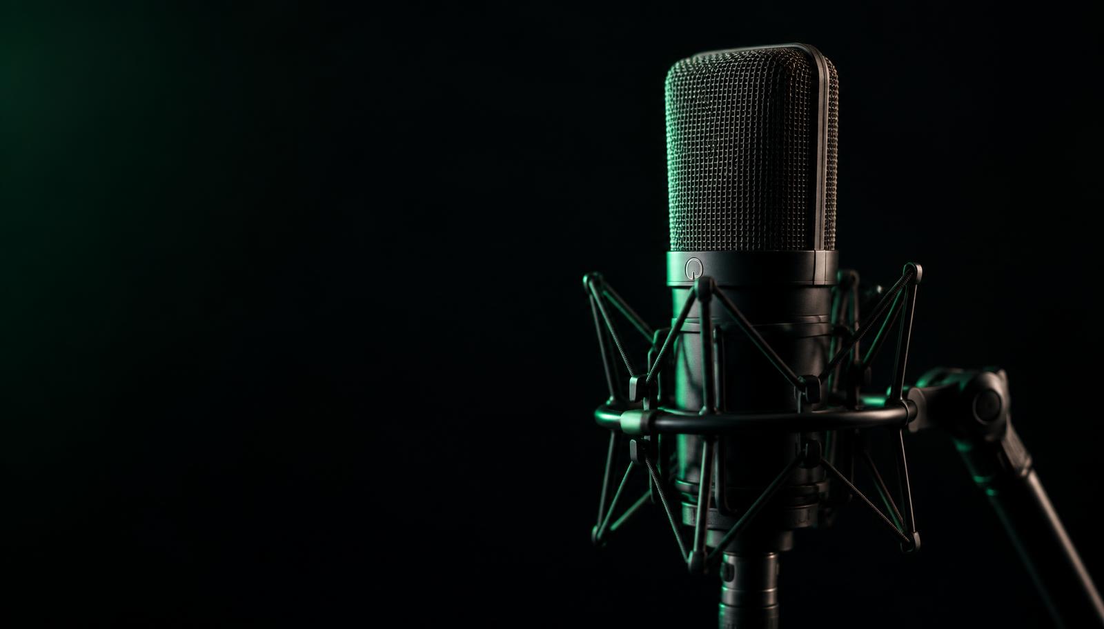 Studio condenser microphone lit with green light